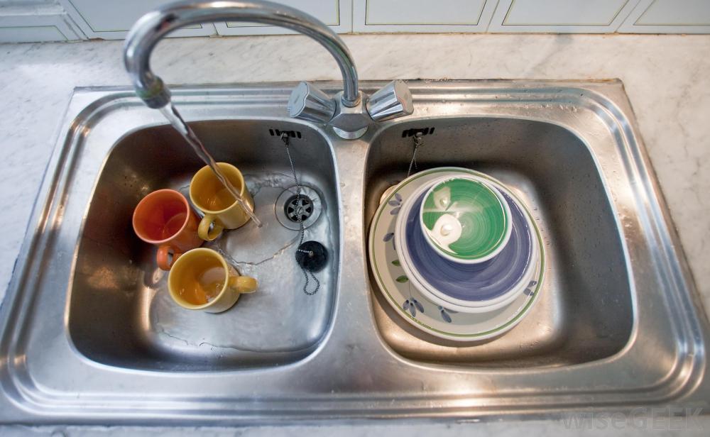 sink-with-dishes-and-water-running